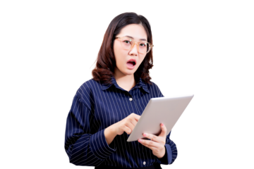A surprised young woman wearing glasses and a striped shirt holds and interacts with a tablet