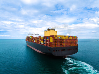 logistic cargo container ship sailing in sea to import export goods and distributing products to...