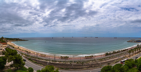 Panorama view of Platja del Miracle beach and Balearic sea on the Dorada coast from Mediterranean Balcony in summer, Tarragona, Catalonia, Spain