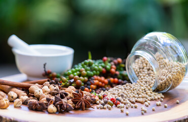 Vibrant peppercorns and aromatic herbs: nature's essence for healthy living and flavorful dishes. Perfect for culinary and wellness themes.