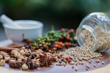 Vibrant peppercorns and aromatic herbs: nature's essence for healthy living and flavorful dishes. Perfect for culinary and wellness themes.
