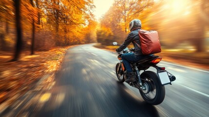 Fototapeta premium Motorcyclist in Autumn Forest Road, Express Delivery Concept