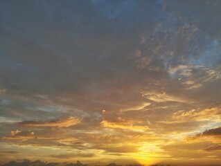 Dramatic sunrise sky view with clouds in summer season 