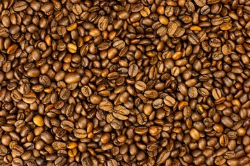 Obraz premium Brown coffee beans macro food background