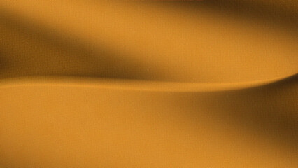luxury golden colored fabric with a smooth texture. Curves or waves on the surface of the fabric. Dynamic play of light and shadow on a luxurious gold background