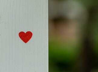 love and romance concept, heart on white wooden wall