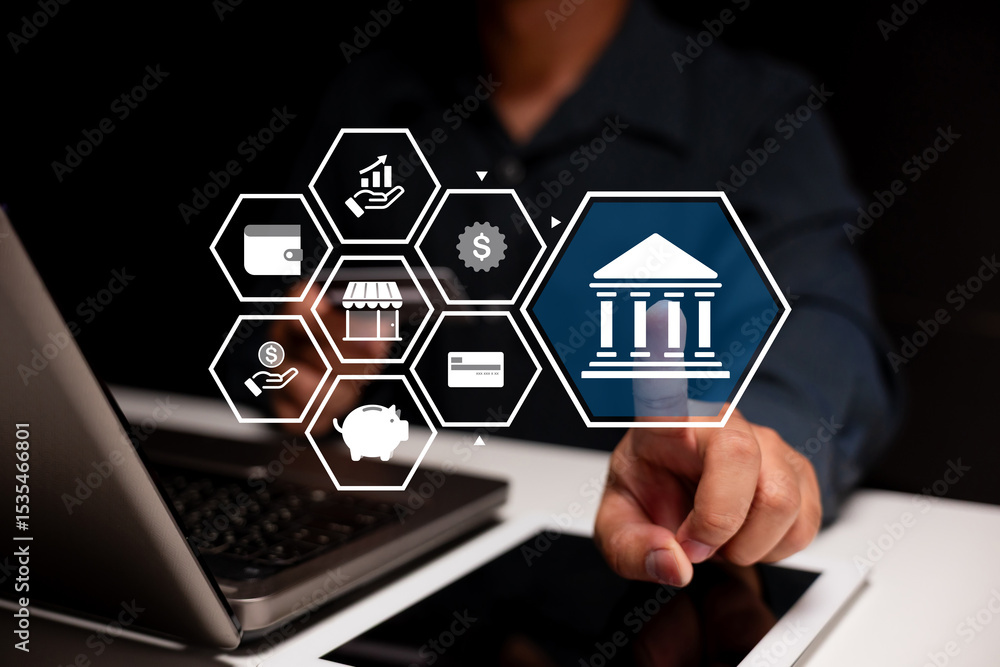 Poster a person interacts with virtual banking icons on a digital interface above a laptop, symbolizing onl