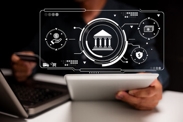 A person using a tablet with digital banking icons and financial technology interface overlay.