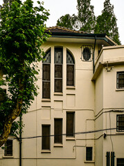 Arched and Rectilinear Windows in Historic Villa Facade