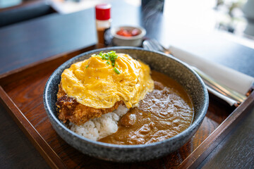 Pork curry rice with omelet.