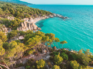 Paradise Kavourotripes Beach, Chalkidiki, Greece. Aerial view of beautiful wild beach shore island with turquoise waters