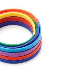 Colorful patterned rubber bracelets stacked in circular arrangement  