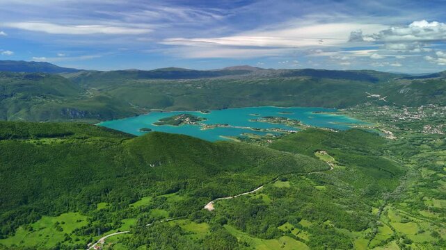 Aerial view of Rama Lake, a beautiful and breathtaking lake with many small islands. It is truly a stunning sight, surrounded by lush green mountain slopes. Bosnia and Herzegovina. 