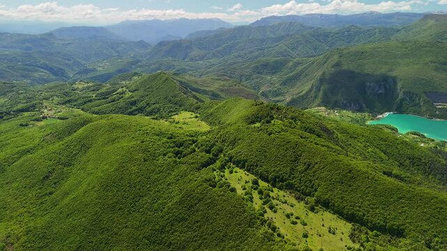 Aerial view of Rama Lake, a beautiful and breathtaking lake with many small islands. It is truly a stunning sight, surrounded by lush green mountain slopes. Bosnia and Herzegovina. 