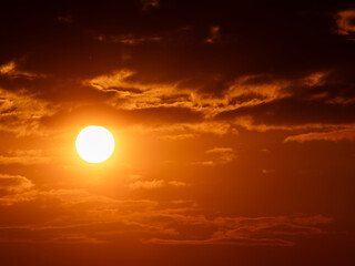 Solar Flame &mdash; A Fiery Sunset Behind the Clouds