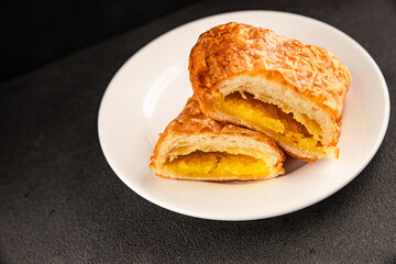 Triangle cake almond puff pastry sweet dessert fresh delicious gourmet food background on the table...