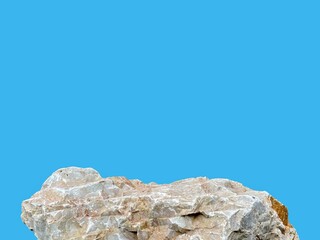 Stone podium rock stand isolated on cyan background with clipping path for product display presentation backdrop.