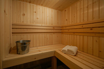 Serene Scandinavian Sauna, A Wooden Retreat with Steam, Bucket, and Relaxing Ambiance for Wellness and Tranquility