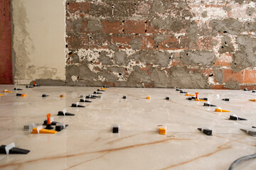 plastic parts used for leveling and spacing floors