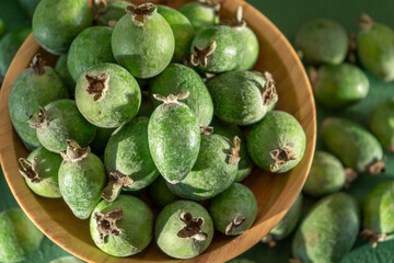 Feijoa green fruit bowl. Diet healthy food. Guava harvest close up