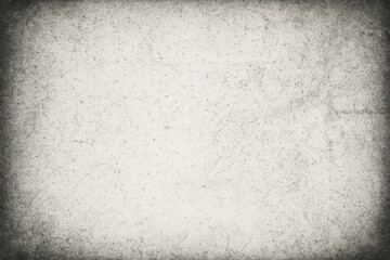 Fototapeta premium Vintage Paper Texture: An aged sheet of paper with a distinct dark vignette creates a unique pattern and evokes a sense of history and timelessness.