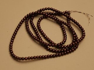 Strings of pearls or beads 