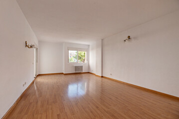 The floor, polished or newly installed, spreads a smooth carpet before our feet