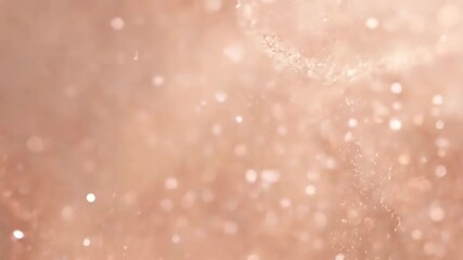 Rose gold bokeh particles floating with soft sparkles and warm light effects. Abstract celebration background for wedding, anniversary and luxury events - Powered by Adobe