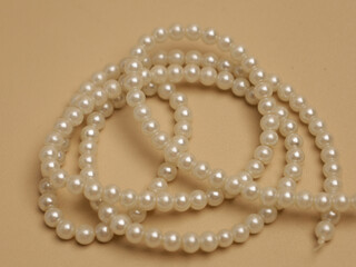 Strings of pearls or beads 