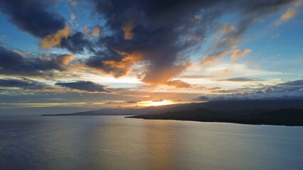 Sunset aerial over calm sea waters