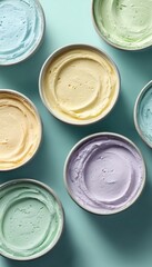 Colorful Flavored Cream Cheese Containers on Mint Background