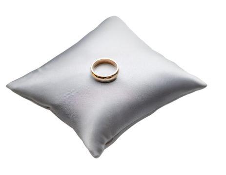 Golden ring on a white pillow