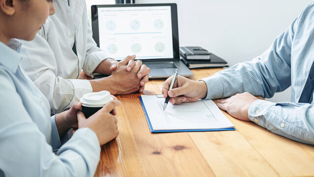 Asian couple meeting with financial advisor to analysis and discussion about investment of new business