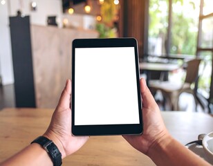 Hands holding tablet in cafe