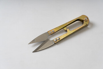 Thread cutting scissors on a white background.  Sewing clippers tailor scissors tool. 