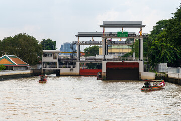 A Serene Waterway adorned with a Lifting Bridge forming part of an Urban Cityscape