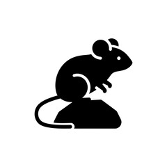 Small mouse sitting quietly on natural rock outdoors