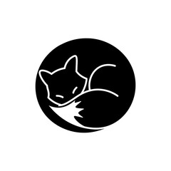 Curled fox sleeping in tight circle on natural ground