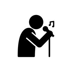 Person singing passionately into a microphone on a stage concert