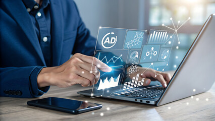 Businessman analyzing data on his laptop screen