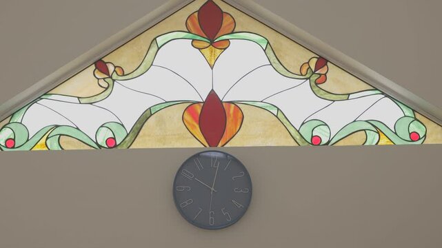 static shot focused on a clock with a beautiful stained glass window, canon eos r 8bits color raw, 4k resolution