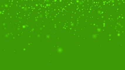 Glowing particle animation with green background perfect for abstract and dynamic content