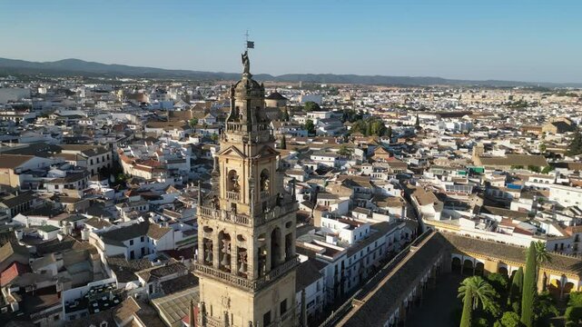Aerial view from a drone of the Mosque-Cathedral of C&oacute;rdoba, Spain and city view at sunset. Iconic blend of Islamic and Christian architecture in a historic Andalusian cityscape.