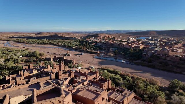 Ouarzazate, Morocco: Panoramic aerial footage of the famous A&iuml;t Benhaddou, or Ben Haddou, ksar, a fortified village for its hill top ancient fort near Ouarzazate in the Moroccan atlas. 