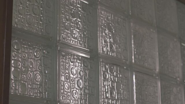 Still shot of a beautifully crafted stained glass window with intricate designs, illuminated by white backlighting, canon eos r 8bits color raw, 4k resolution
