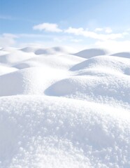 A serene snow-covered hill glistens under the bright blue sky, with fluffy white clouds drifting lazily, creating a picturesque winter landscape.