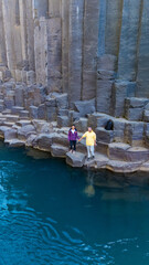 Discover the breathtaking landscape of Studlagil Canyon in Iceland, featuring striking basalt...