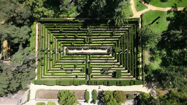 Aerial view from a drone of the hedge maze in the Royal Alc&aacute;zar of Seville, Spain. Historic garden design ideal for tourism, architecture, and cultural heritage themes.