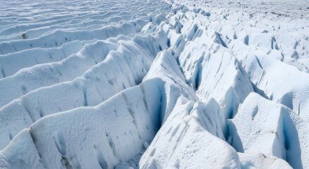 Obraz premium Stunning aerial view of a glacier's textured surface ice formations showing patterns and crevasses