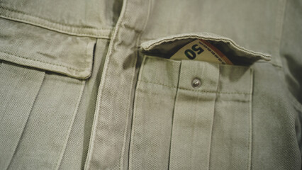 50 Euro Banknote Hidden in Shirt Pocket.Bribery Concept.